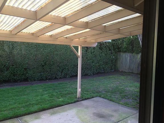 covered patio in landscaped garden