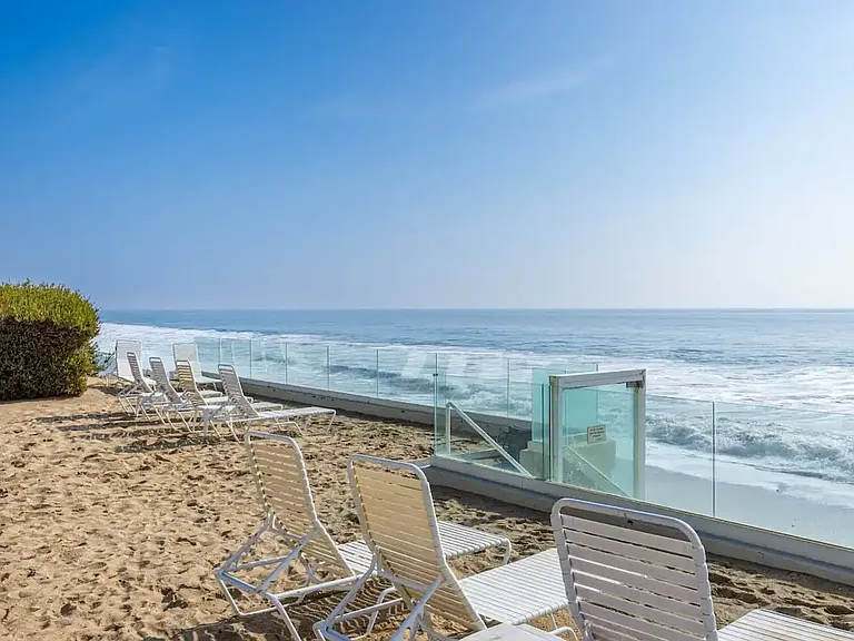 Recline in beachfront serenity on the comfortable outdoor lounge chair, where the rhythm of the waves becomes your soundtrack.