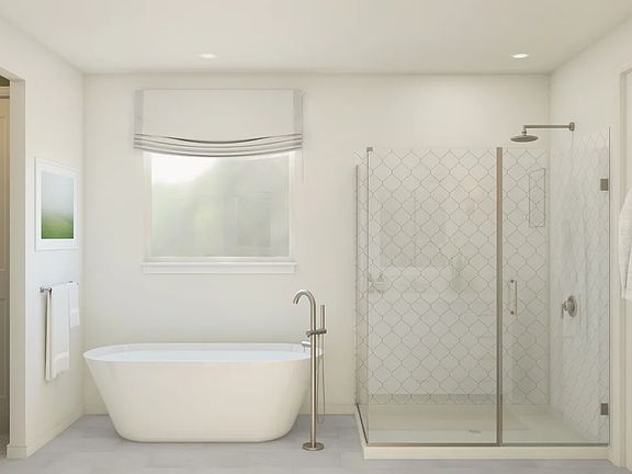 Primary bath with freestanding tub and glass shower enclosure