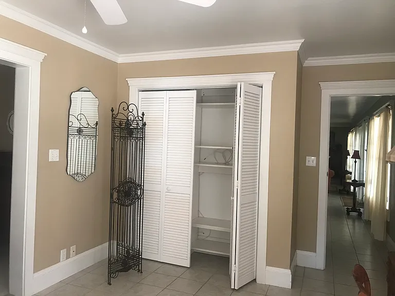 KAENNA MB CLOSET WITH ORGANIZER - VIEW OF DOORWAY INTO BAR AREA