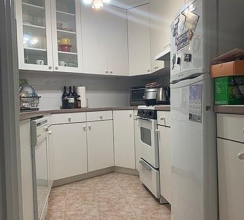 Cozy Kitchen with Doors Closing it Off from the Living Area