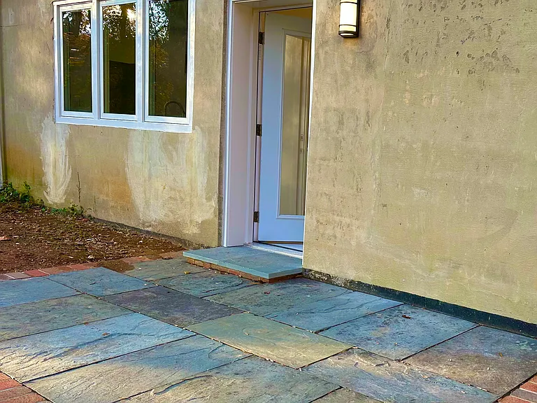 Private entrance and stone patio