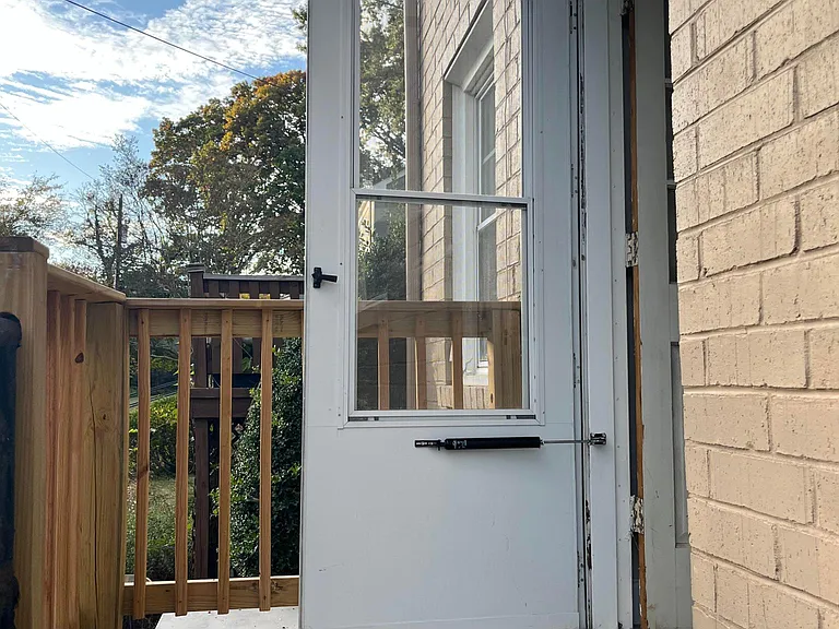 Back door to green way access with brand new roof
