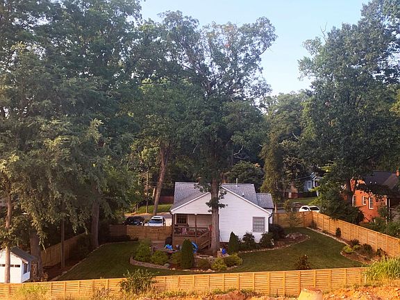 Fenced in backyard with entertainment area, tree house and beautiful flowers. Great for entertaining!