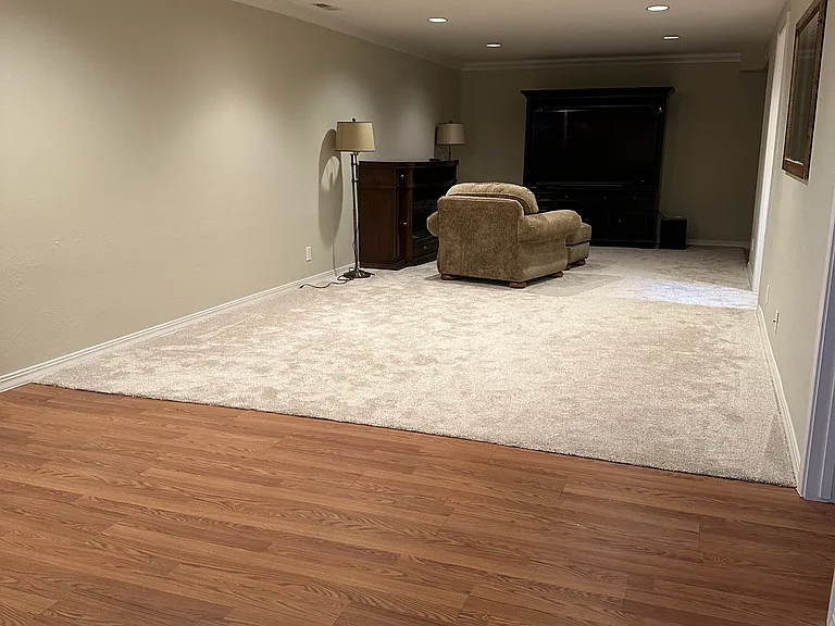 view over dining area toward TV zone