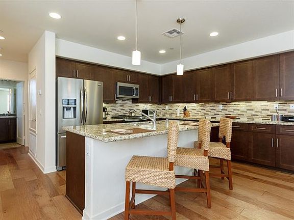 Kitchen with Granite Counters & Stainless Appliances.