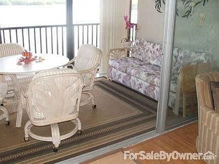 Couch for relaxing on lanai
						:
						A quiet spot for reading. Table handy for drinks or bridge with friends