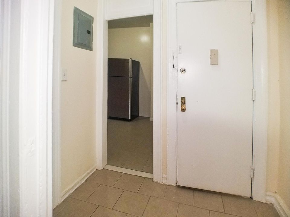 Foyer with kitchen and bathroom to the left