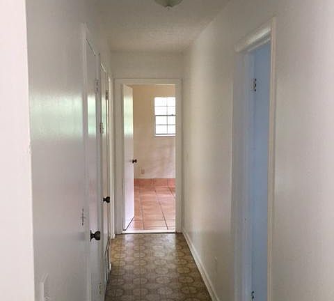 Hallway to rest of home. Storage closet on left, Air conditi