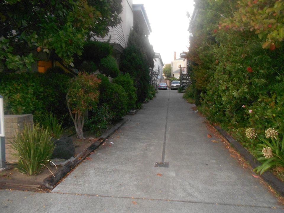 Driveway entrance from San Jose Avenue to your building (left side) driving into the carport area for parking.