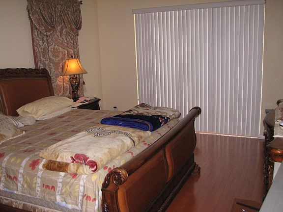 Master Bedroom w/ Sliders to the Pool Area