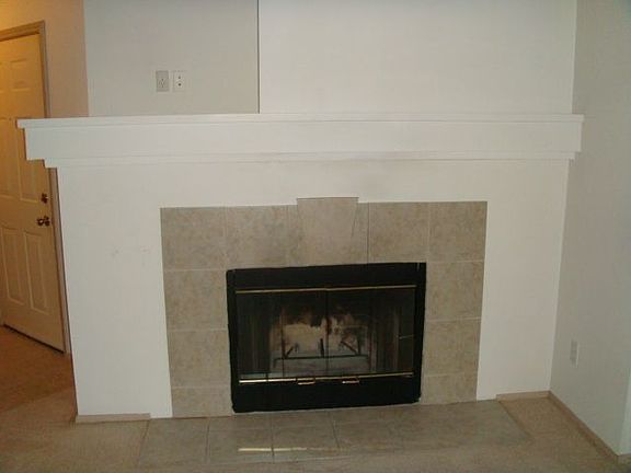 wood fireplace in living room