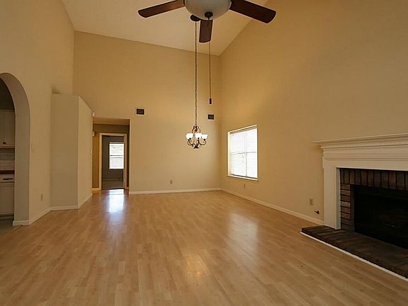 Large, light living area with a fireplace.