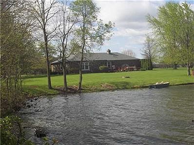 Exterior Front. Front View Across Water