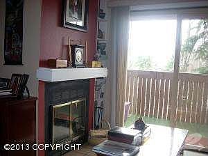 Fireplace & sliding glass door to deck