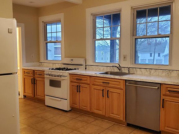 Kitchen...plenty of cabinets, windows, gas cooking, dishwasher
