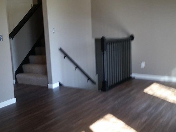 New Iron spindles on stairs down, opening to 2nd floor above