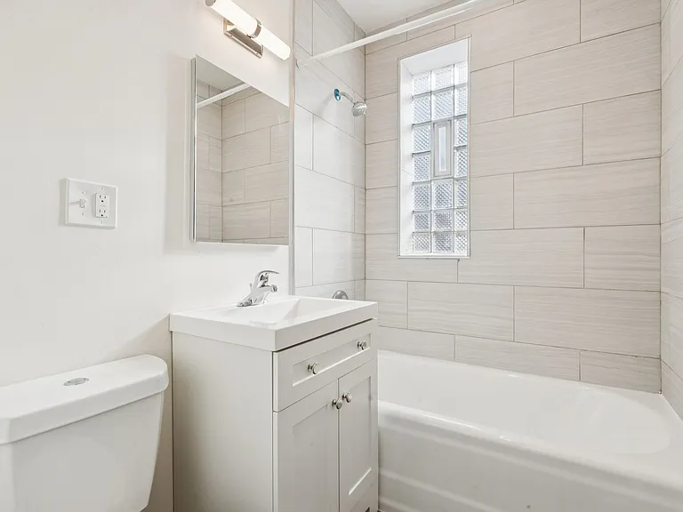 Bathroom with Full Size Tub and Tile Surround