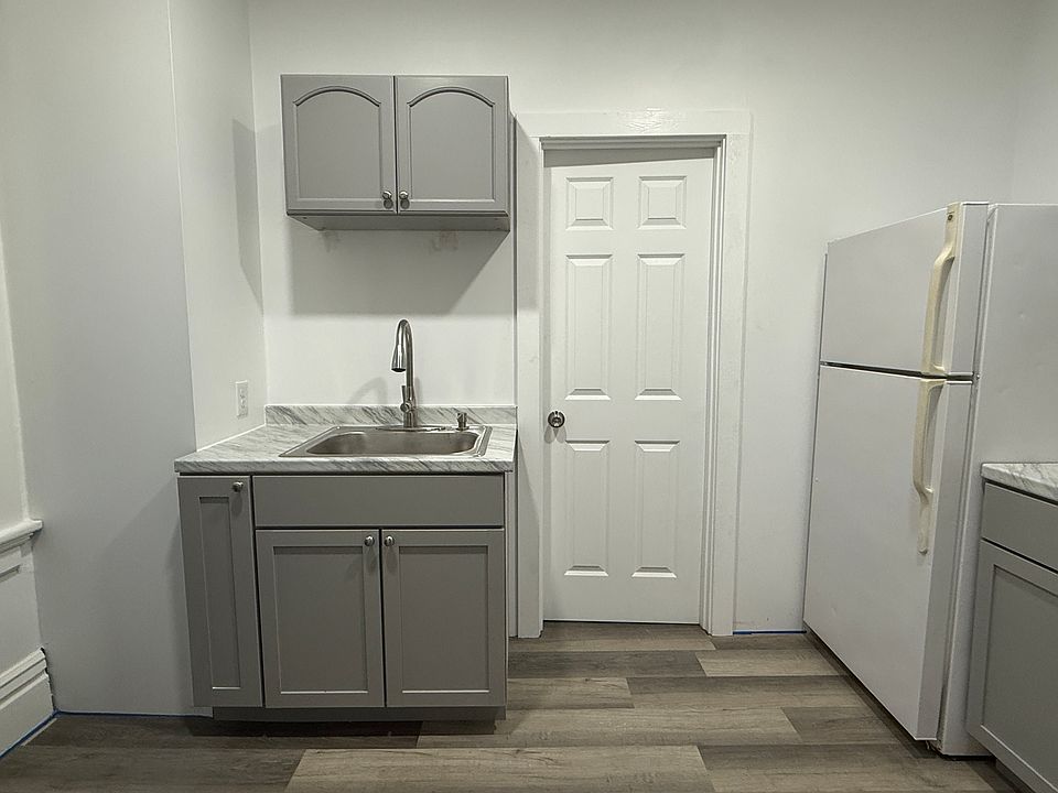 Kitchen sink & door to bathroom.