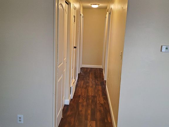 Hall to three bedrooms and bathroom