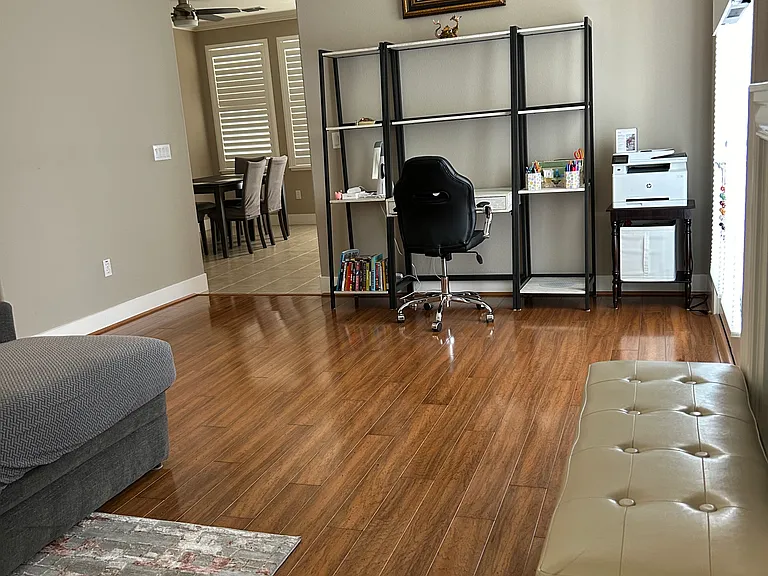 2nd level Living room with L-shaped sofa And a small office area with printer