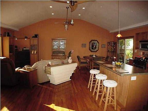 Great Room with new kitchen and gleeming hardwood floors