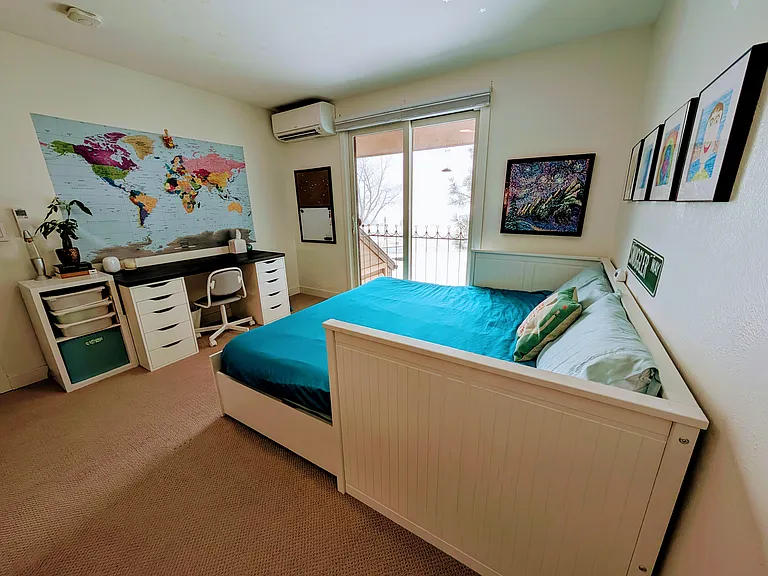 Upstairs Bedroom 2 - King bed that can be converted into a single daybed, desk, book shelves, a large walk-in closet, and access to a private balcony with open space views.