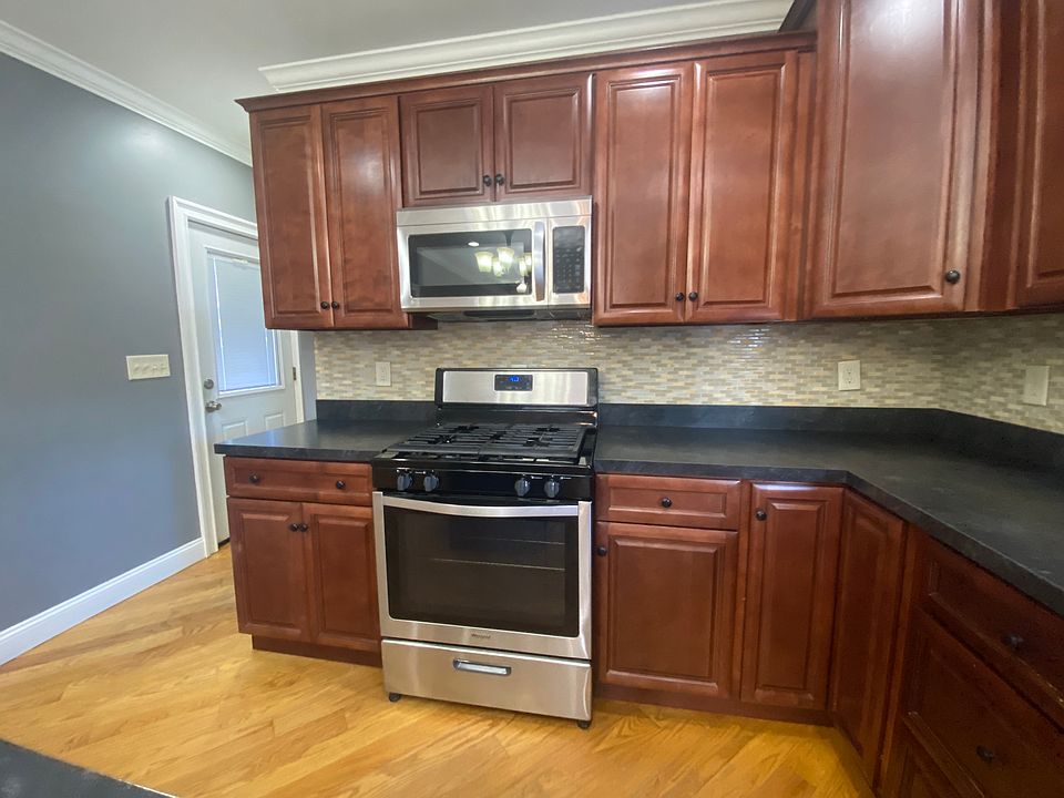View of the stainless, gas range and microwave.