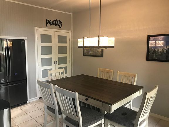 Huge pantry in dining area with updated lighting features.