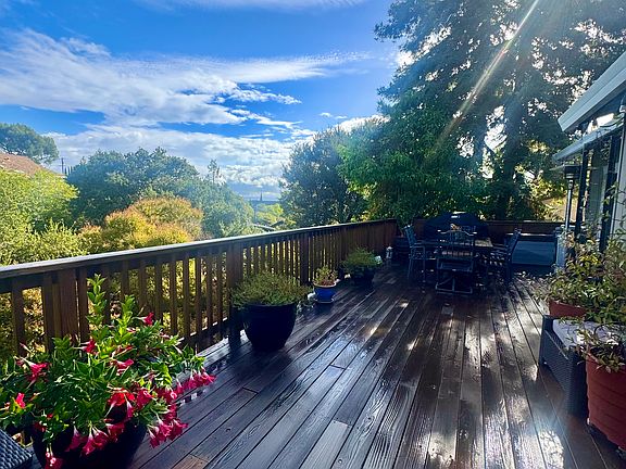 Deck off the living room and primary suite.