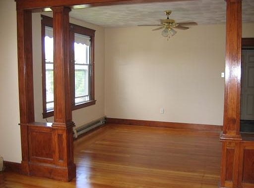 Double living room with gleaming hardwoods