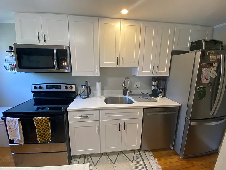 Kitchen cabinets, counter and appliances installed in 2025.