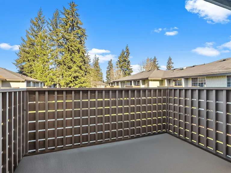 Relax and unwind on your private balcony with stunning views of tall evergreens. Relax and unwind on your private balcony with stunning views of tall evergreens.