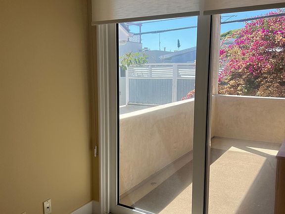 Master bedroom with balcony access