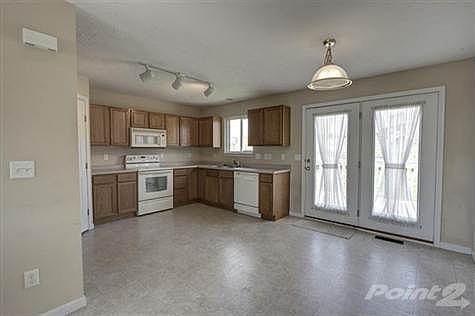 The kitchen offers a dishwasher, microwave and oven/range with plenty of cabinets and counter tops. The pantry offers adequate space for storage. In addition, there is a walkout onto the oversized deck that overlooks the rear flat yard.