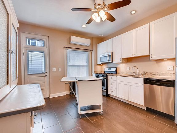 Eat-in kitchen with move-able center island/work station