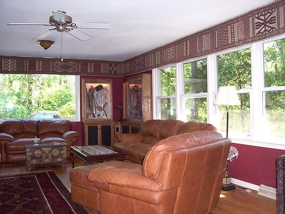Another view of the living room highlighting the large windows