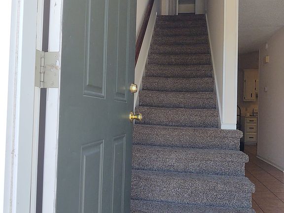 Entrance - view of linen closet on 2nd floor, hallway & living-room on 1st floor.