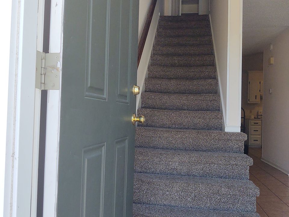 Entrance - view of linen closet on 2nd floor, hallway & living-room on 1st floor.