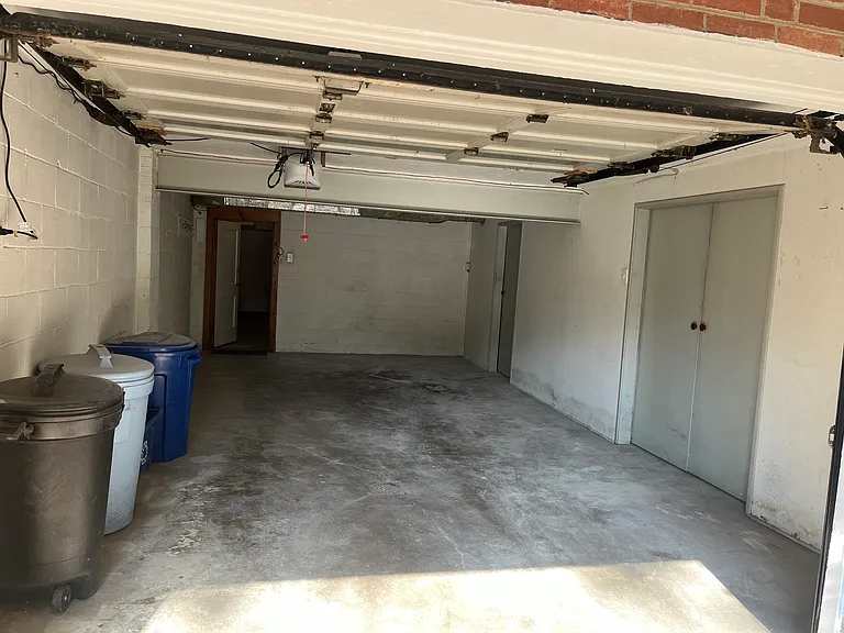 Garage. Back door leads into basement. Side doors lead into large storage closets.