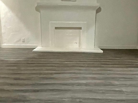 Faux fireplace on south wall of living room.