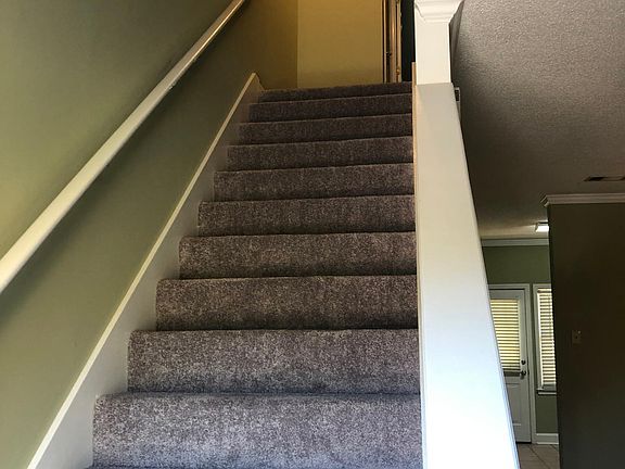 Stairway to the second floor and bedrooms.