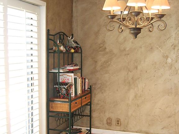 Nice eat-in area in kitchen; plantation shutters cover sliding glass doors