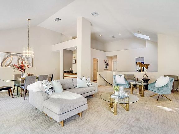 Living room (family room) where you can enjoy relaxing on the comfortable couches and have a wonderful mealtime in the dining area.