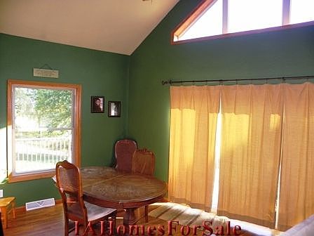 Dining Area has great view overlooking property and sliding door to deck.