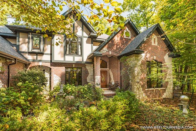 This exceptional custom home sits on nearly 2 acres of wooded privacy, only moments from downtown Yo