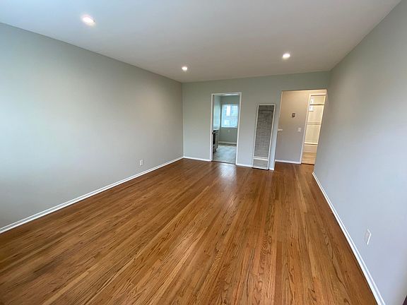 Living Room with refinished original hardwood floors, newly painted throughout the apartment