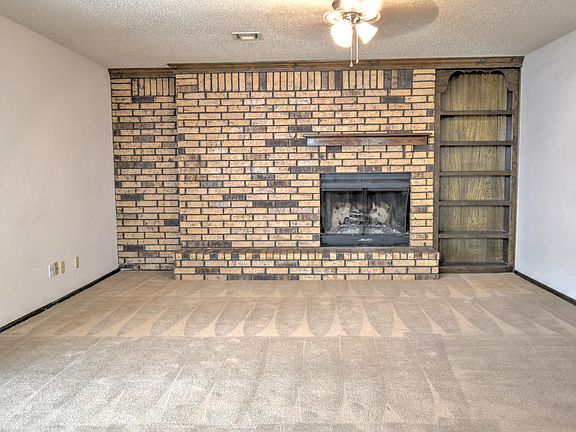 Living room with wood burning fireplace
