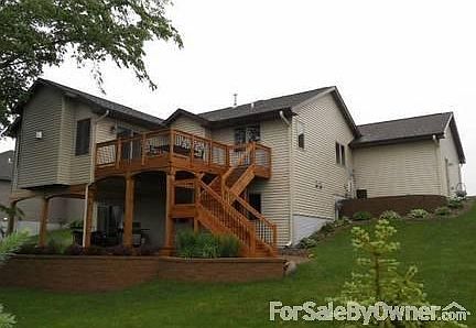 Rear View
						:
						Retaining wall, cedar deck, and patio.