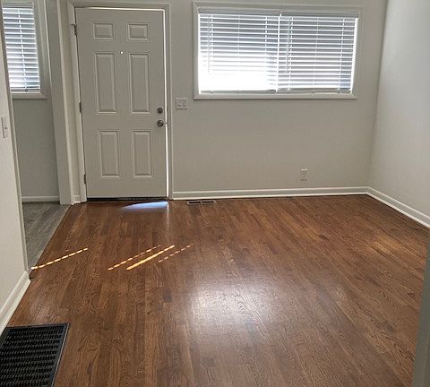 Bright living room opens into kitchen